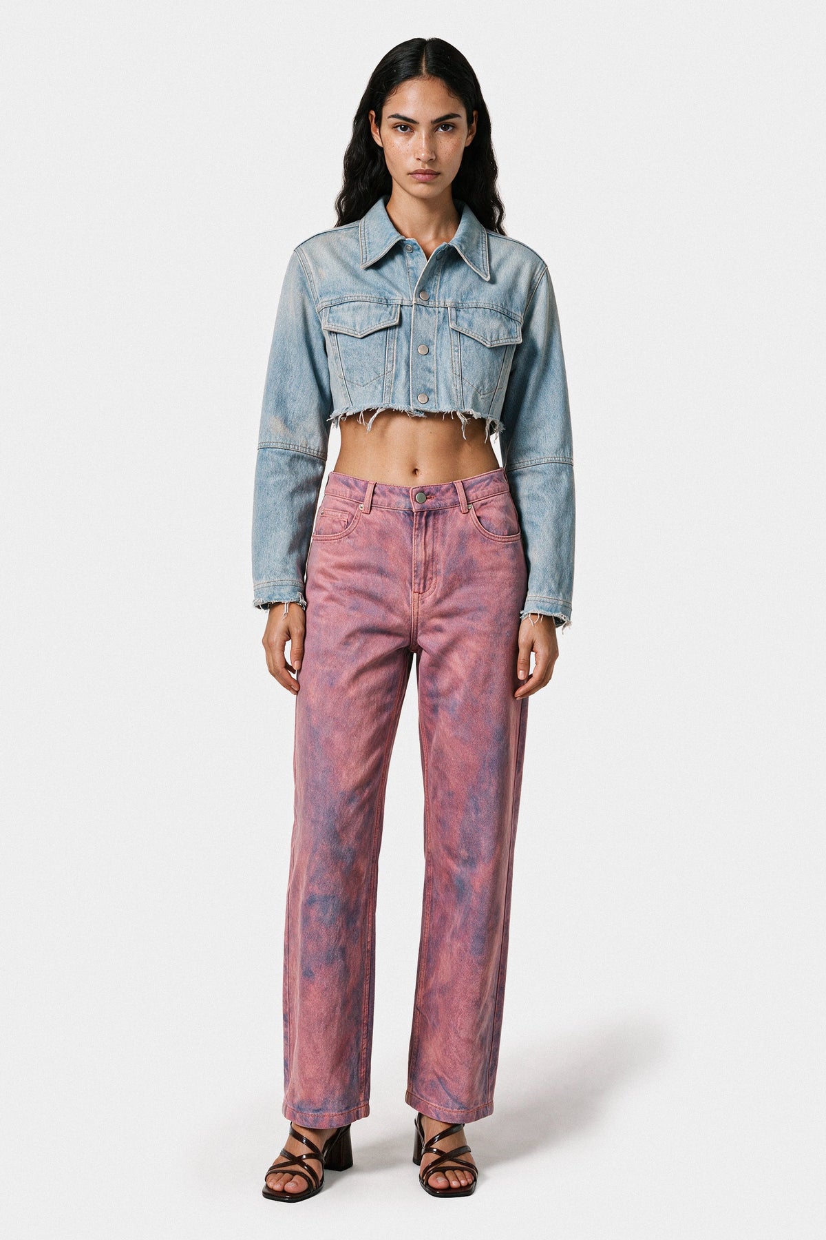Pink denim pants styled with a blue denim jacket
