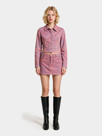 Pink denim trucker jacket styled with the pink denim mini skirt