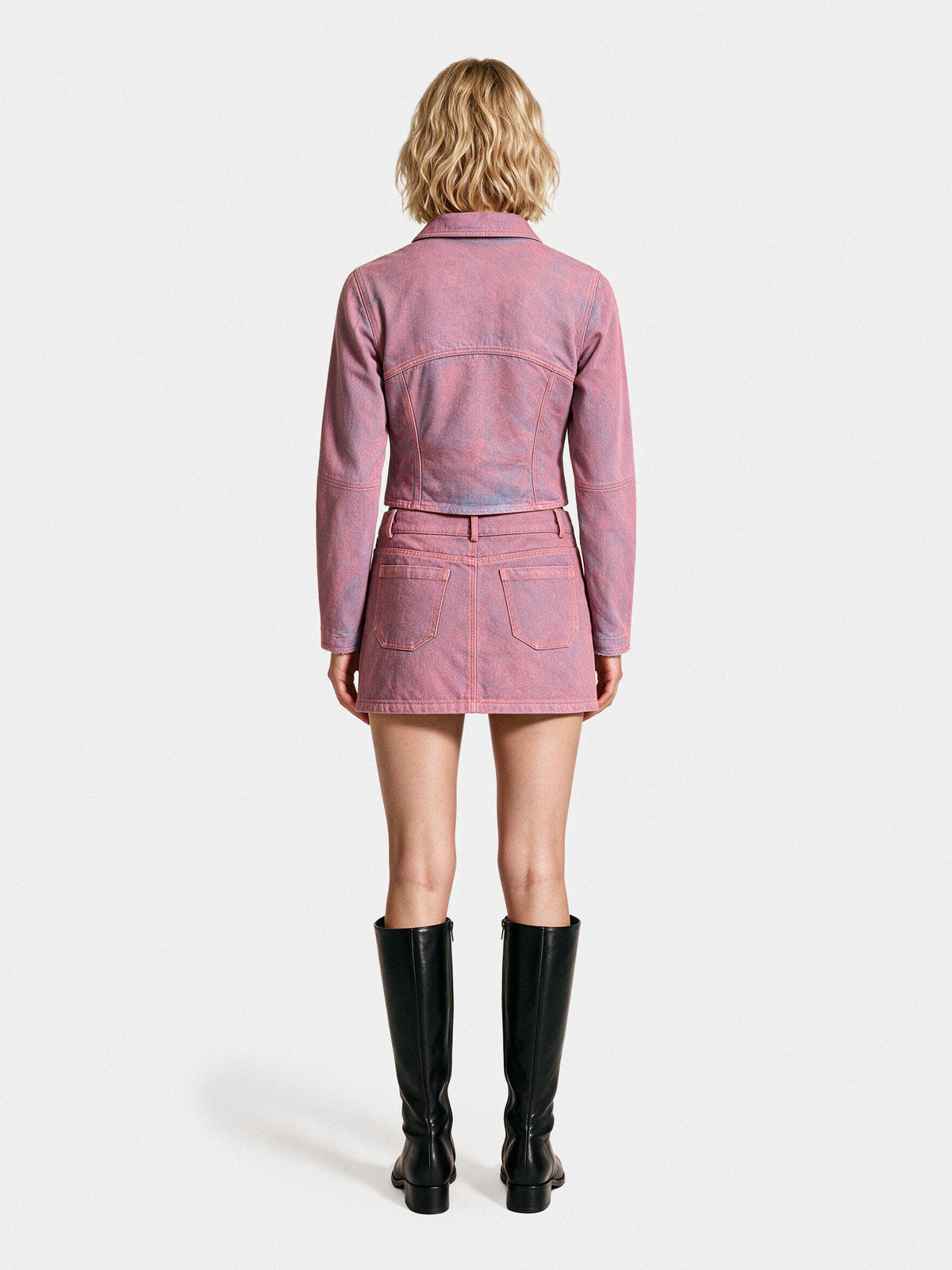 Pink denim trucker jacket and mini skirt, back view
