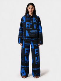 Model wearing the printed pants with matching printed jacket
